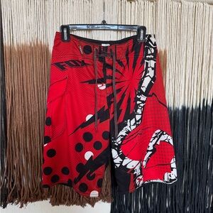 Red & black Fox Racing 9” inseam swim trunks with a cargo pocket; good condition